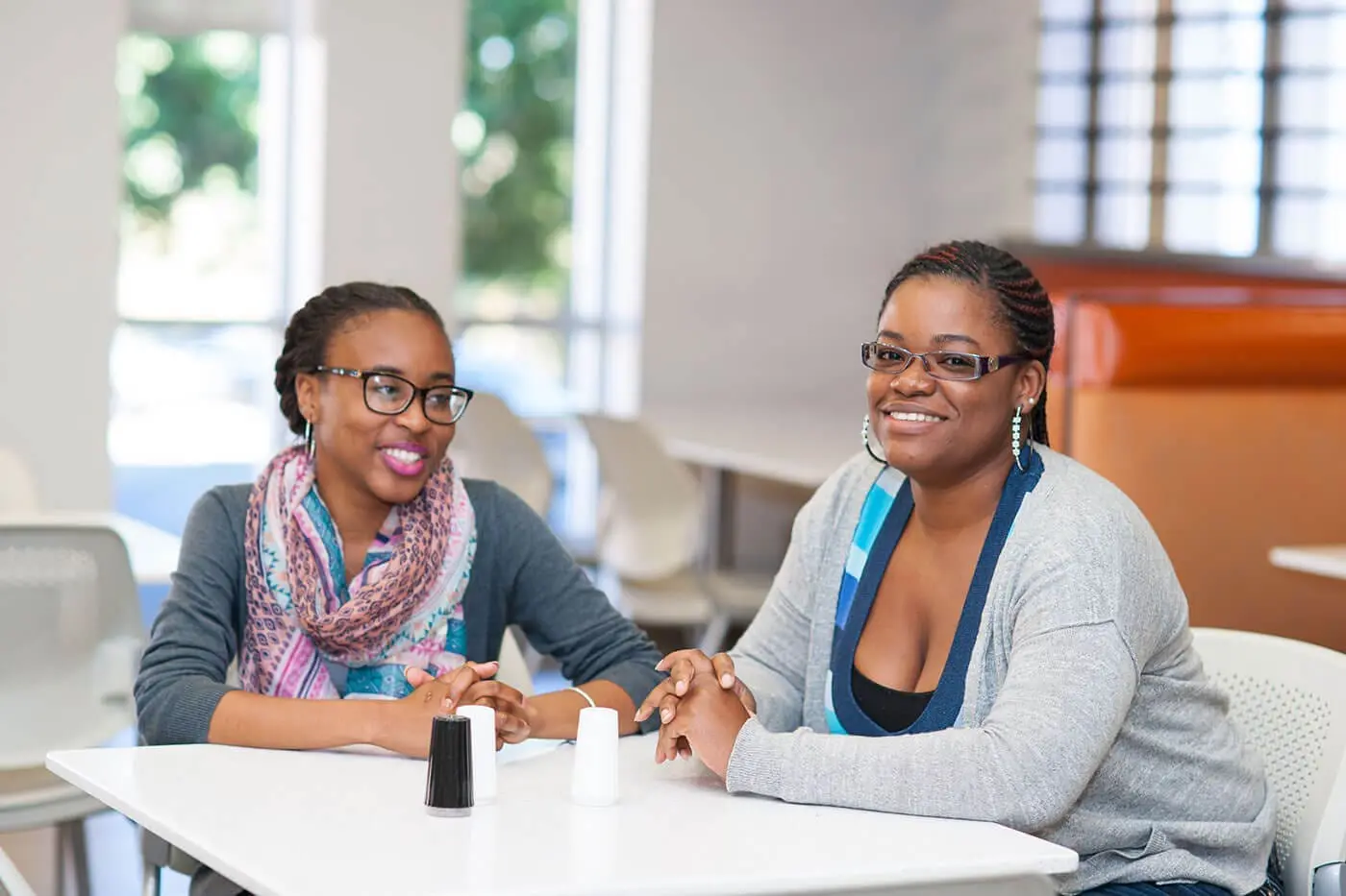 Two students at table
