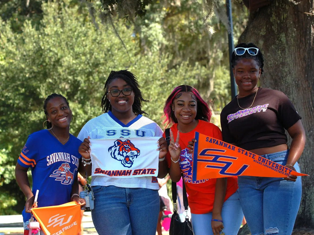 Students holding school banners