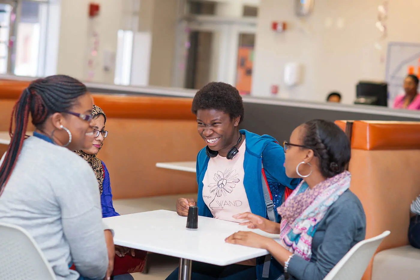 Students having conversation at table