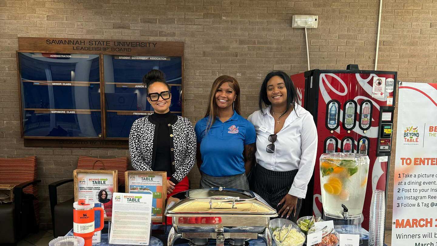 Dietitians standing around table